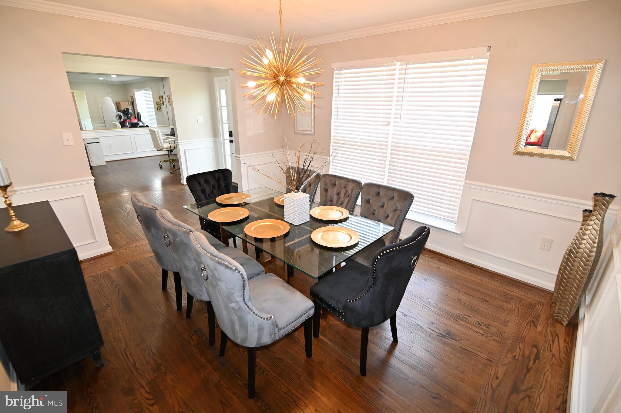 6009 Sellner Lane Clinton, MD 20735 - Photo 12 of 61 a view of a dining room with furniture window and wooden floor