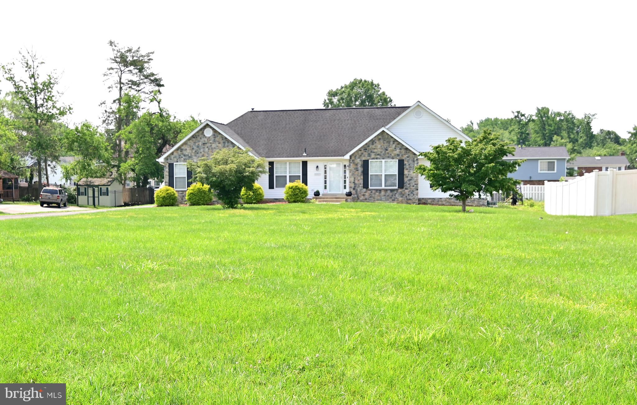 6009 Sellner Lane Clinton, MD 20735 - Photo 2 of 61 a front view of a house with a yard and garage