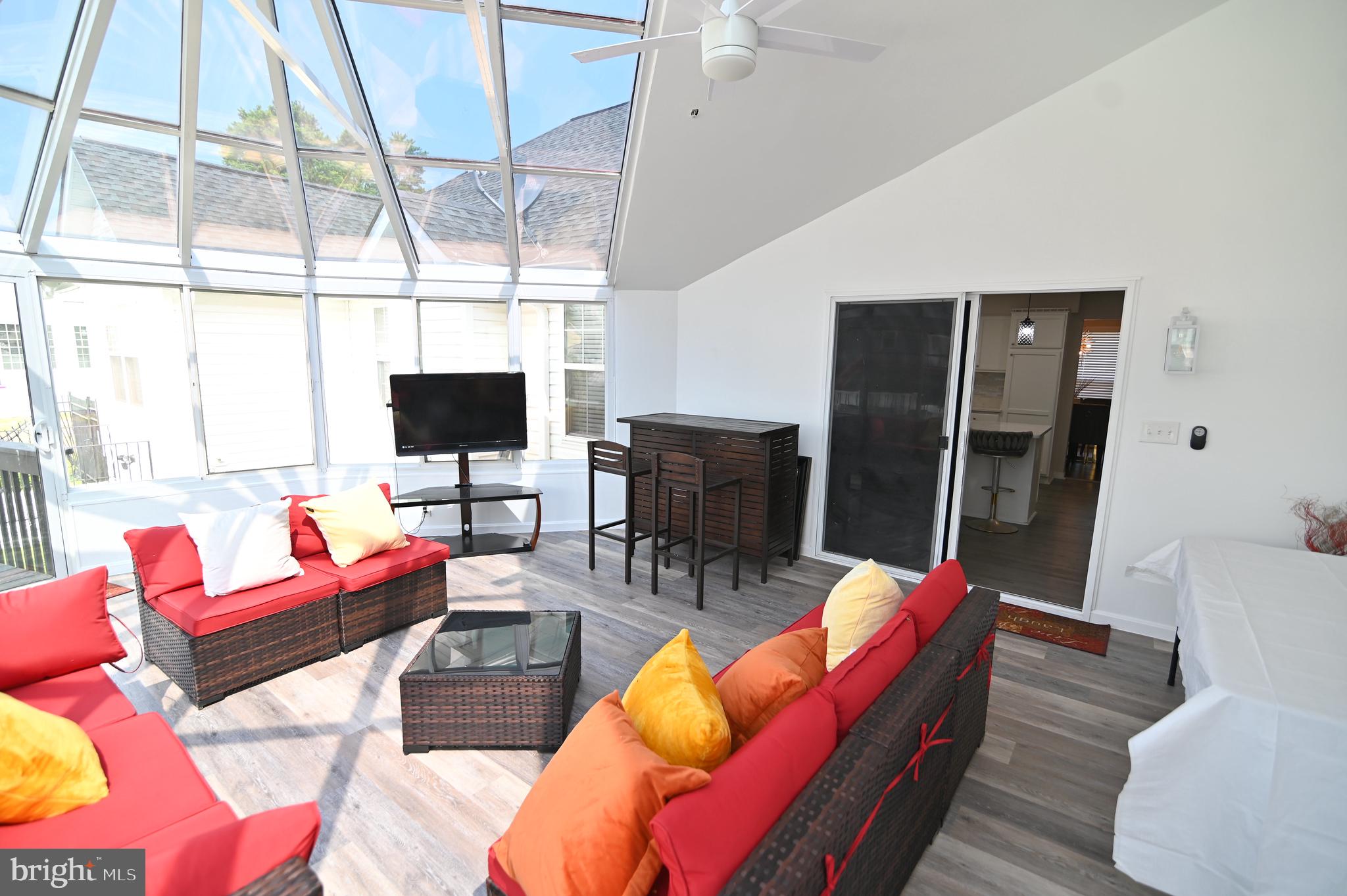 6009 Sellner Lane Clinton, MD 20735 - Photo 24 of 61 a living room with furniture a flat screen tv and a large window