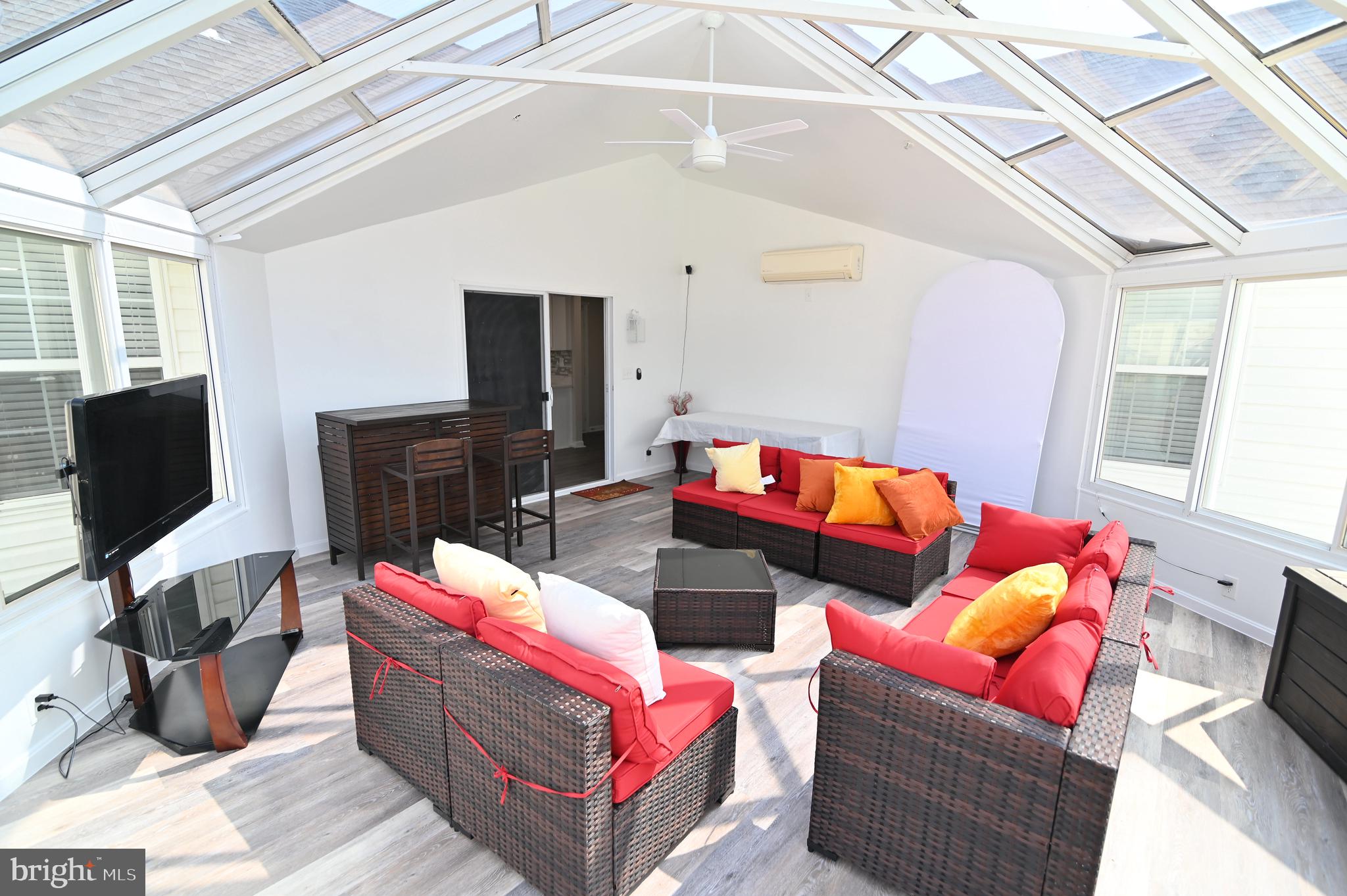 6009 Sellner Lane Clinton, MD 20735 - Photo 25 of 61 a living room with furniture a flat screen tv and a fireplace