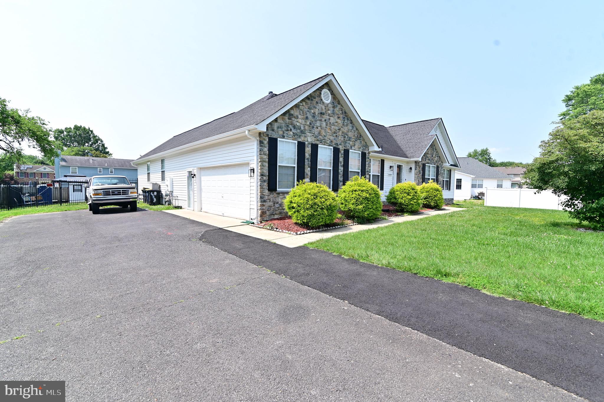 6009 Sellner Lane Clinton, MD 20735 - Photo 3 of 61 a view of a house with a yard and plants