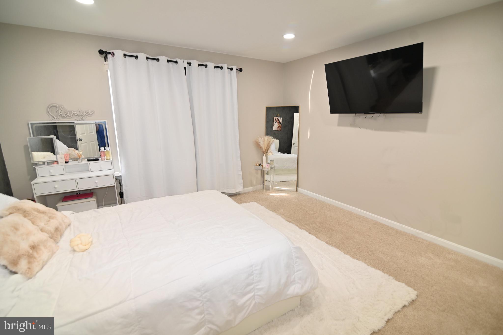 6009 Sellner Lane Clinton, MD 20735 - Photo 37 of 61 a bedroom with a bed and a flat screen tv