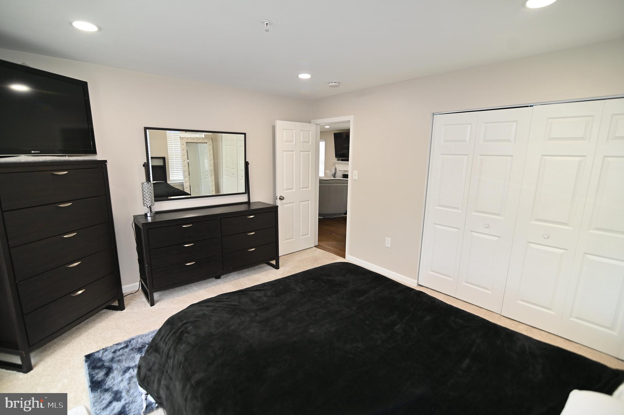 6009 Sellner Lane Clinton, MD 20735 - Photo 40 of 61 a bedroom with a bed and a dresser