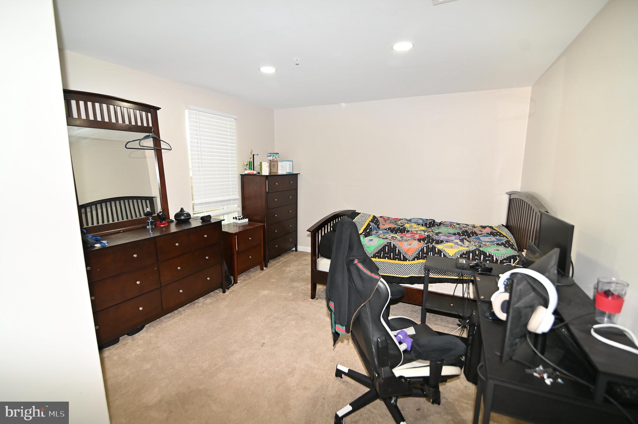 6009 Sellner Lane Clinton, MD 20735 - Photo 53 of 61 a bed room with a bed and a television