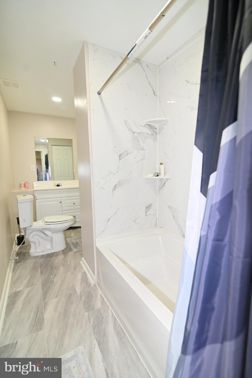 6009 Sellner Lane Clinton, MD 20735 - Photo 57 of 61 a bathroom with a bathtub and a toilet