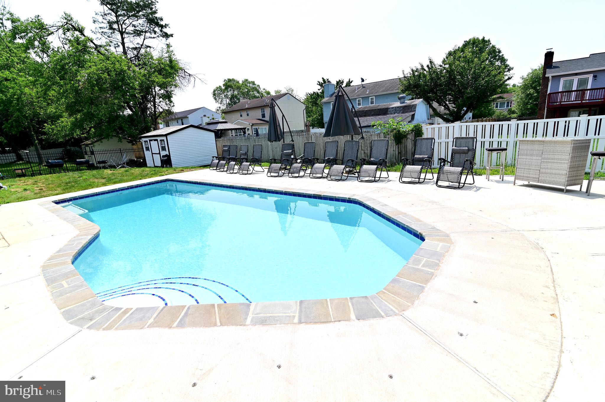 6009 Sellner Lane Clinton, MD 20735 - Photo 59 of 61 a swimming pool with outdoor seating and yard