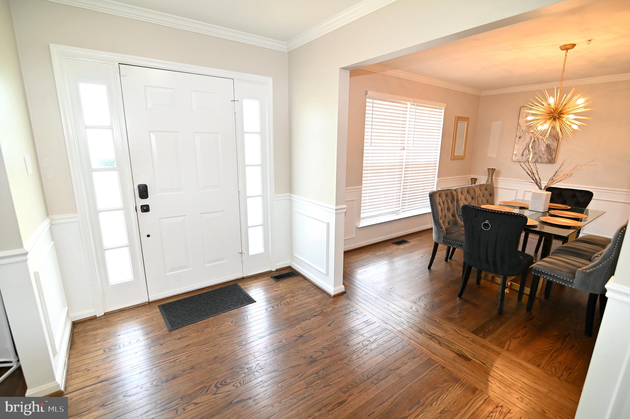 6009 Sellner Lane Clinton, MD 20735 - Photo 9 of 61 a view of a dining room with furniture and wooden floor