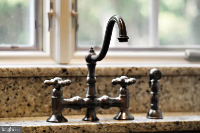 a view of living room with furniture and a large window