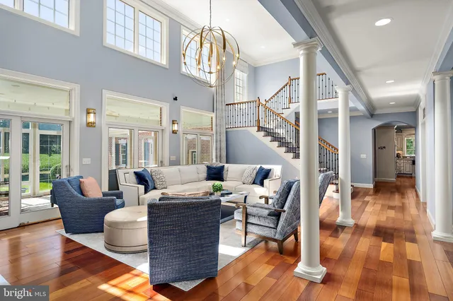 a bedroom with a bed and painting on the wall