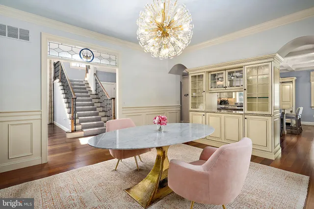 an aerial view of a house with a yard basket ball court and outdoor seating