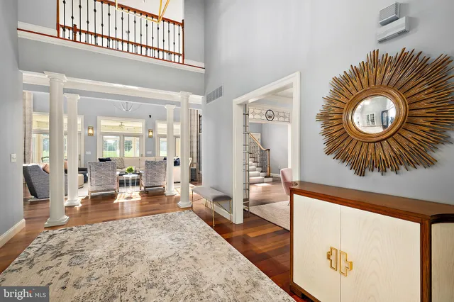 a living room with furniture fireplace and window