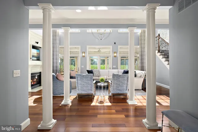a living room with furniture fireplace and flat screen tv