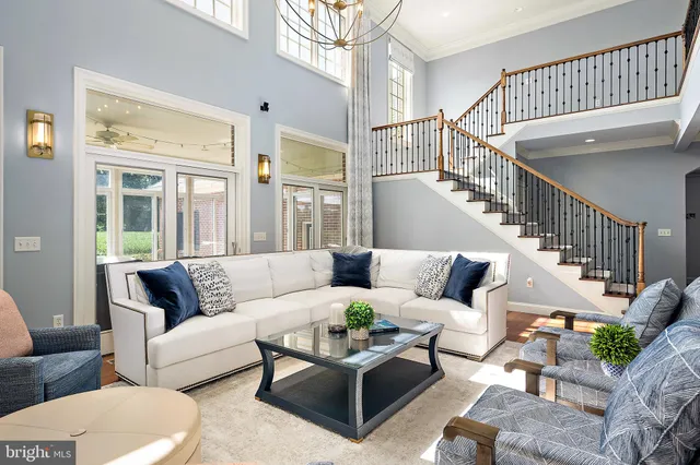 a living room with furniture fireplace and a flat screen tv
