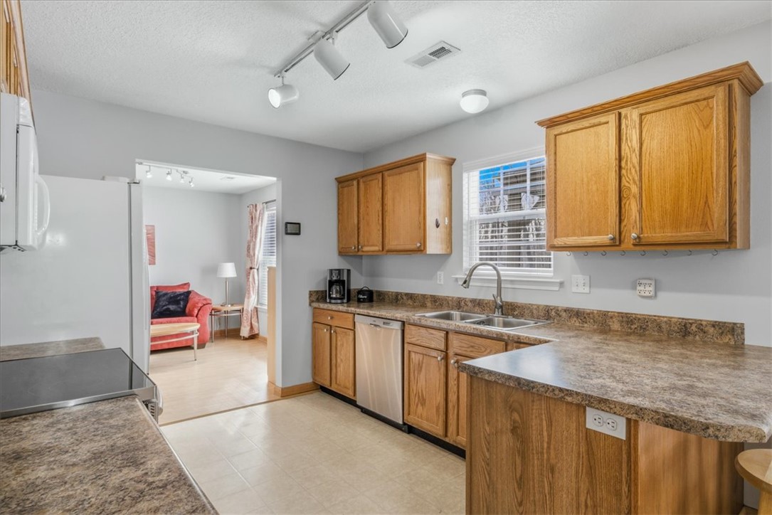 102 Tc-2-168 Pendleton, SC 29670 - Photo 10 of 44 This bright kitchen features wood cabinetry and ample counter space, perfect for everyday living.
