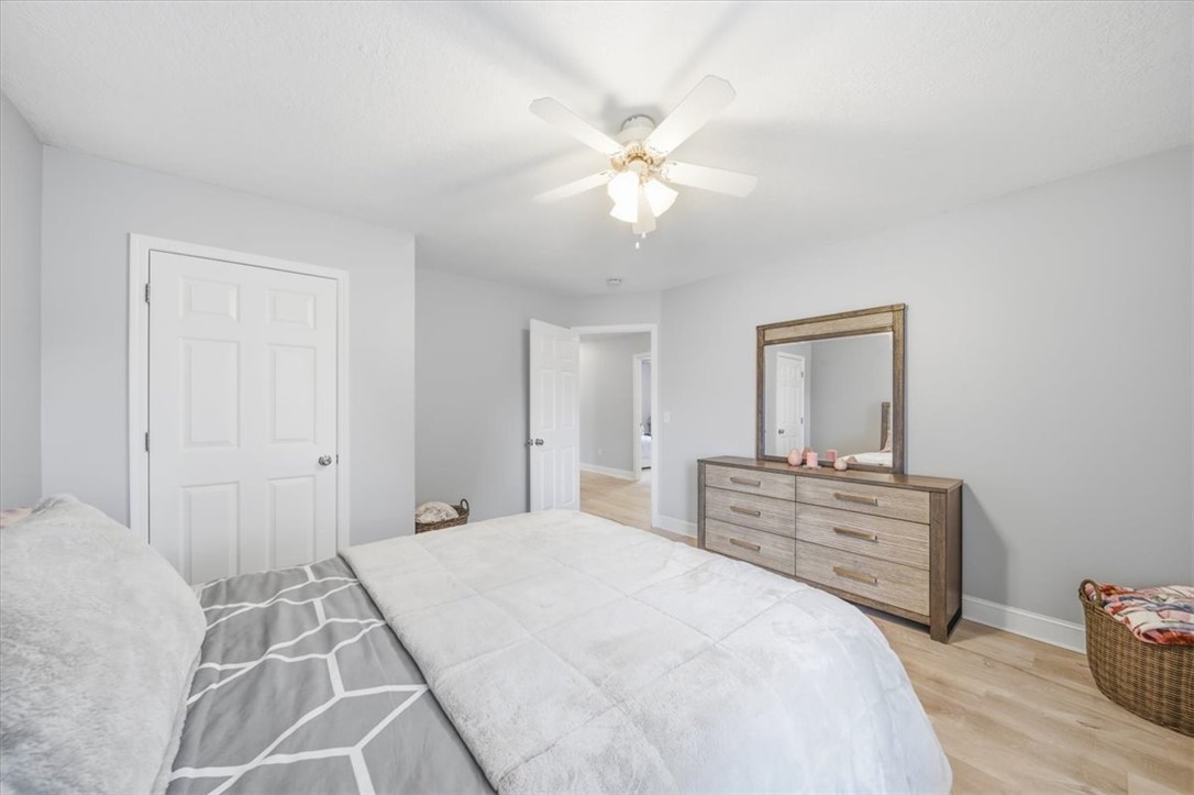 102 Tc-2-168 Pendleton, SC 29670 - Photo 22 of 44 Bright and airy, this sleeping space features beautiful flooring and a refreshing overhead fan.