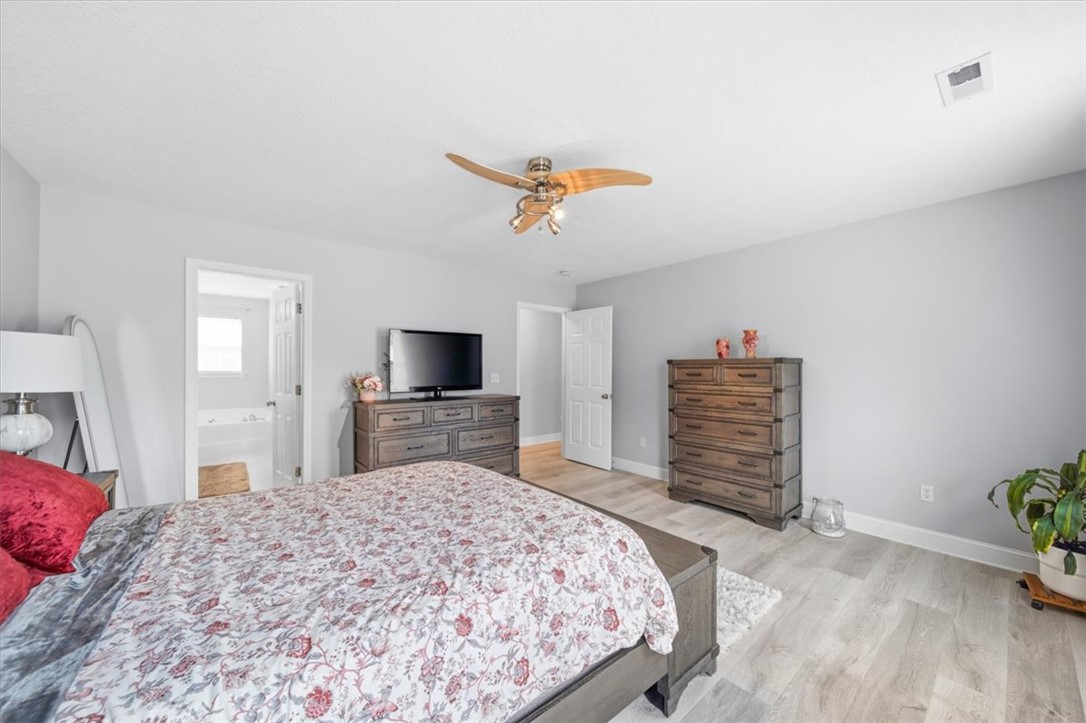 102 Tc-2-168 Pendleton, SC 29670 - Photo 25 of 44 This spacious primary bedroom features durable flooring and a refreshing ceiling fan.