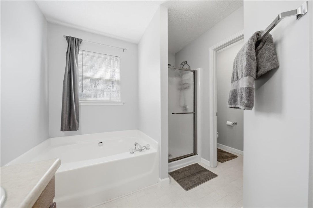 102 Tc-2-168 Pendleton, SC 29670 - Photo 27 of 44 This bathroom features a soaking tub and a separate shower, creating a functional space for personal care.