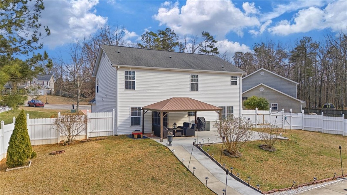 102 Tc-2-168 Pendleton, SC 29670 - Photo 31 of 44 This residence features a well-maintained yard and a comfortable patio area.