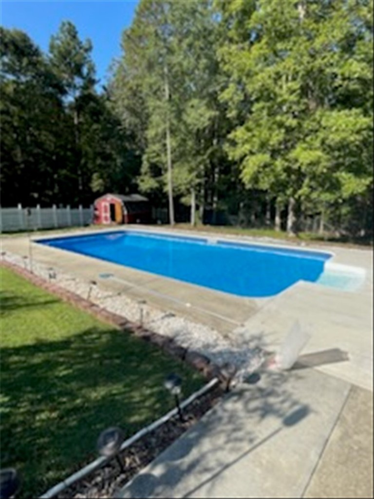 102 Tc-2-168 Pendleton, SC 29670 - Photo 38 of 44 This private outdoor space features a sparkling inground pool and a charming storage shed.