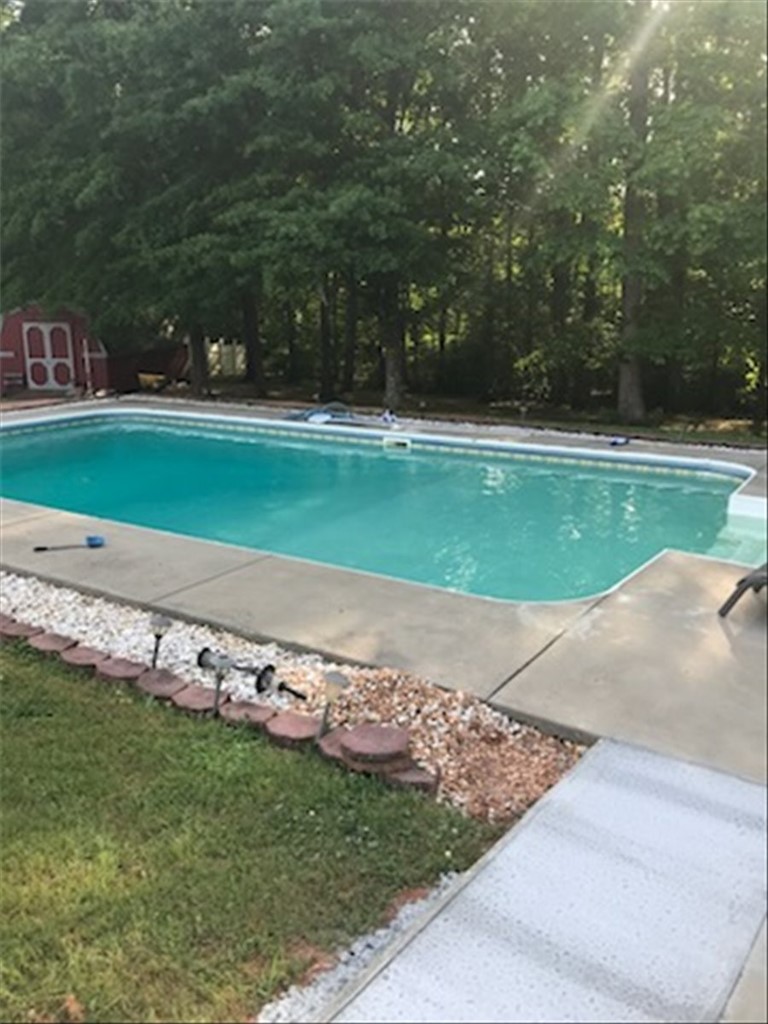 102 Tc-2-168 Pendleton, SC 29670 - Photo 42 of 44 This tranquil backyard features a private swimming area, perfect for relaxation and outdoor enjoyment.