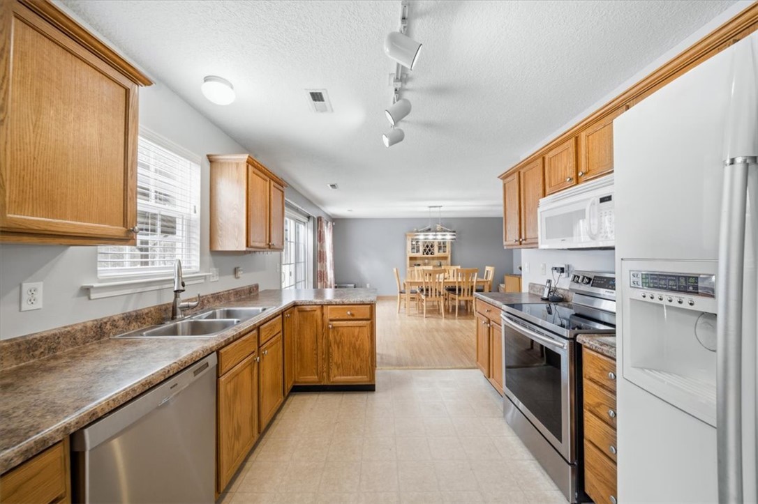 102 Tc-2-168 Pendleton, SC 29670 - Photo 9 of 44 This spacious kitchen offers ample cabinet space and modern appliances, flowing into an inviting dining area.