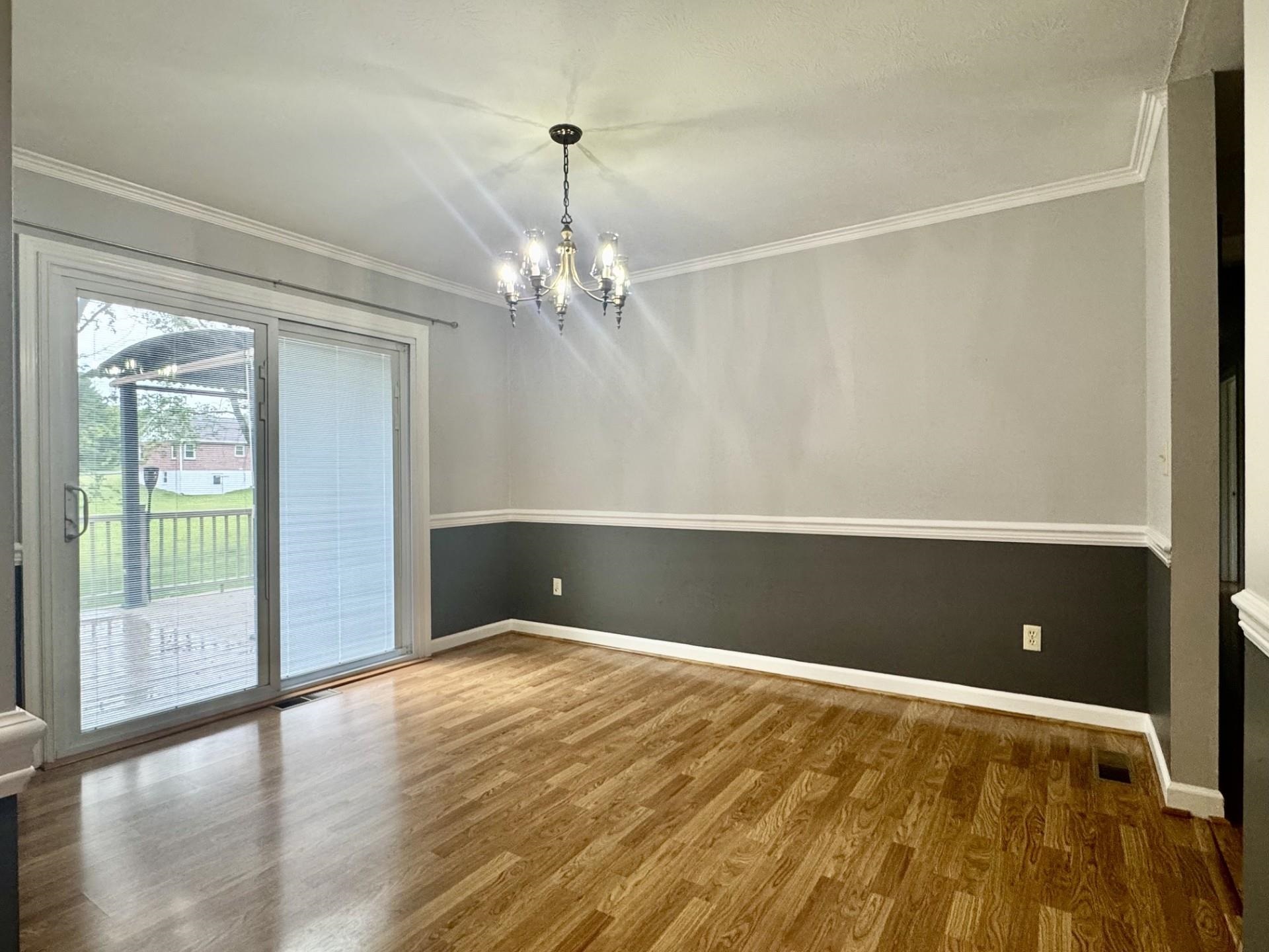 81 Middlebrook Street Harrisonburg, VA 22801 - Photo 6 of 22 a view of empty room with window and wooden floor