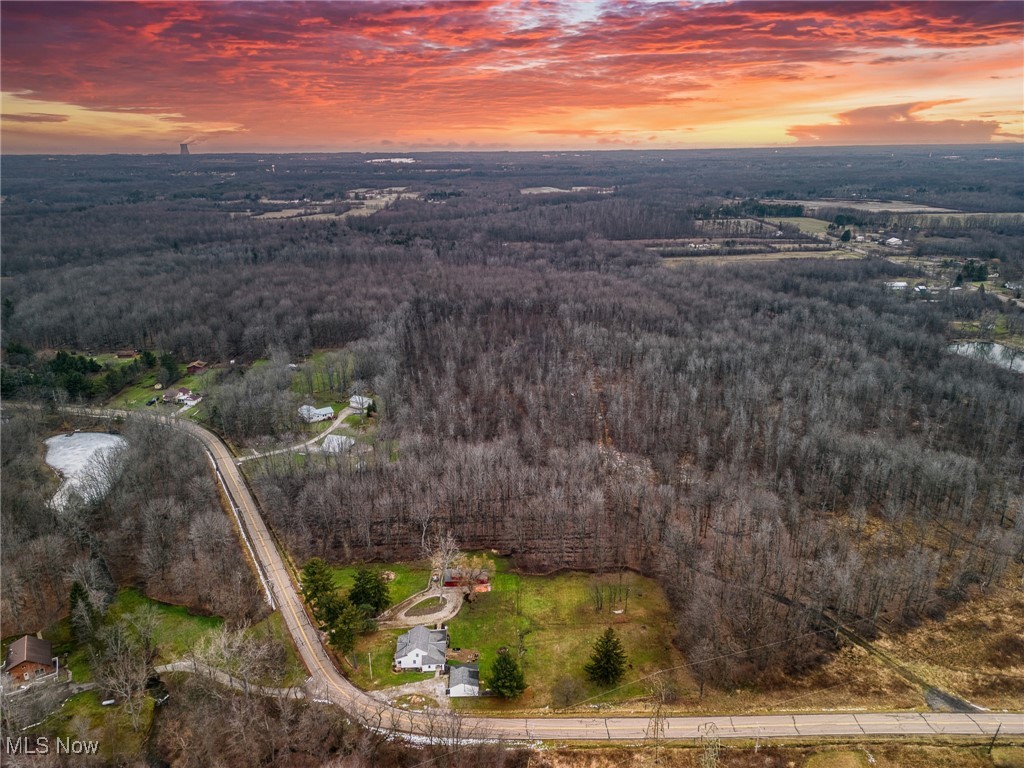 Aerial view at dusk of a wooded view