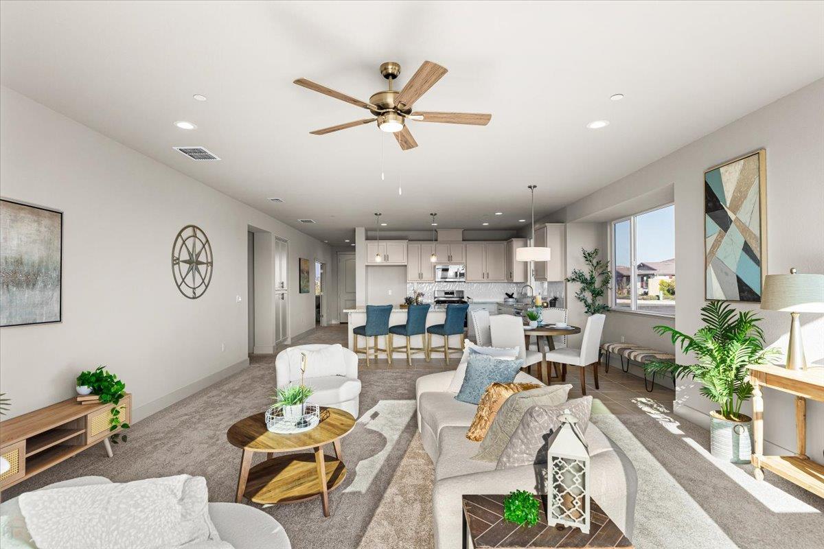 2970 East Tuolumne Road Turlock, CA 95382 - Photo 33 of 68 a living room with lots of furniture and view of kitchen