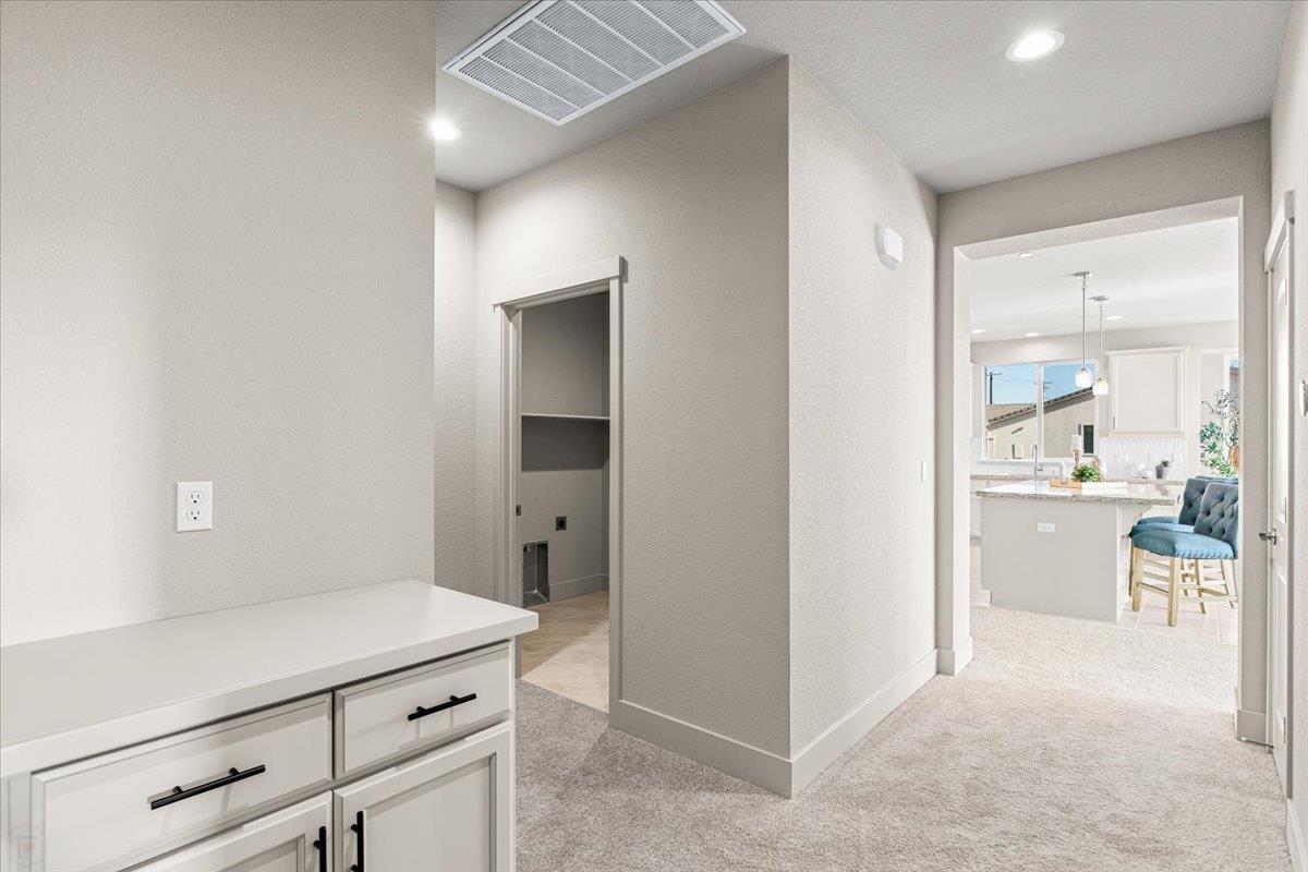 2970 East Tuolumne Road Turlock, CA 95382 - Photo 37 of 68 a view of a hallway to dining room with cabinet