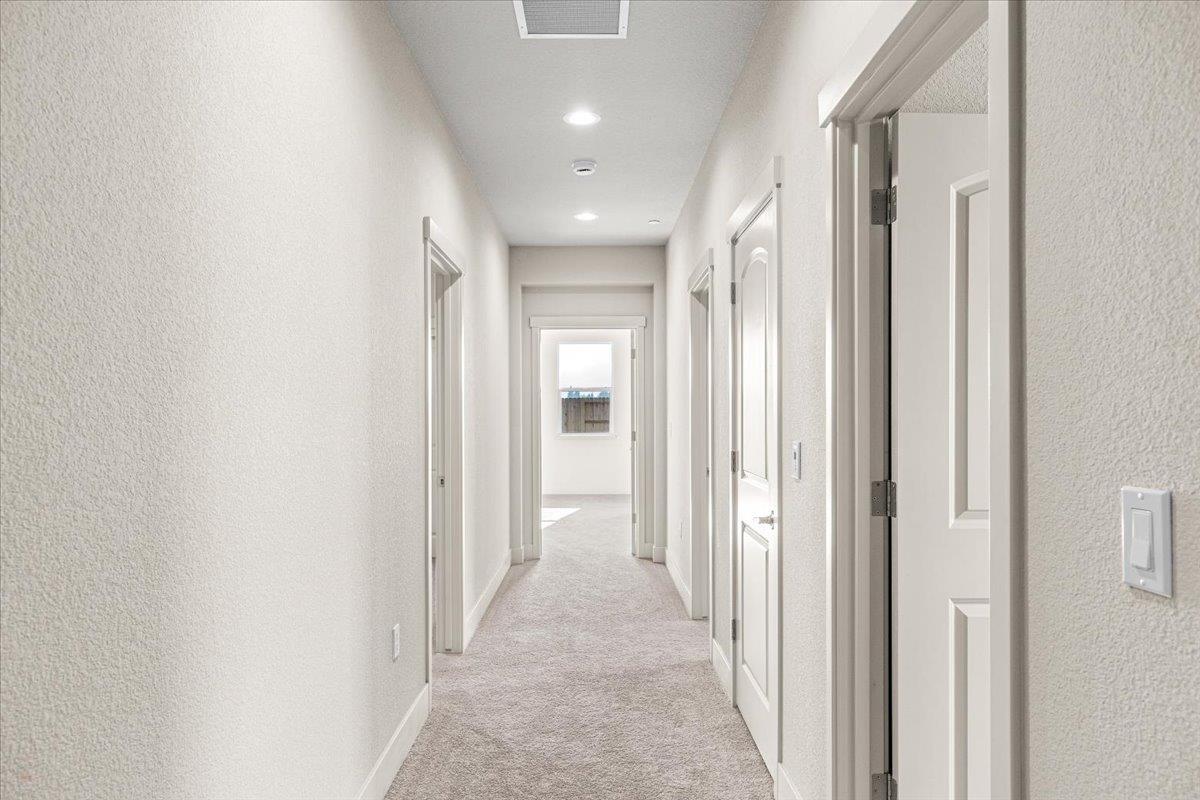 2970 East Tuolumne Road Turlock, CA 95382 - Photo 40 of 68 a view of a hallway with wooden shelves