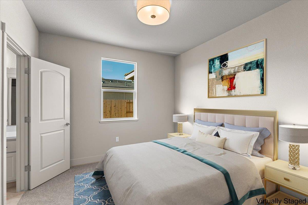 2970 East Tuolumne Road Turlock, CA 95382 - Photo 42 of 68 a bedroom with a bed and a painting on the wall