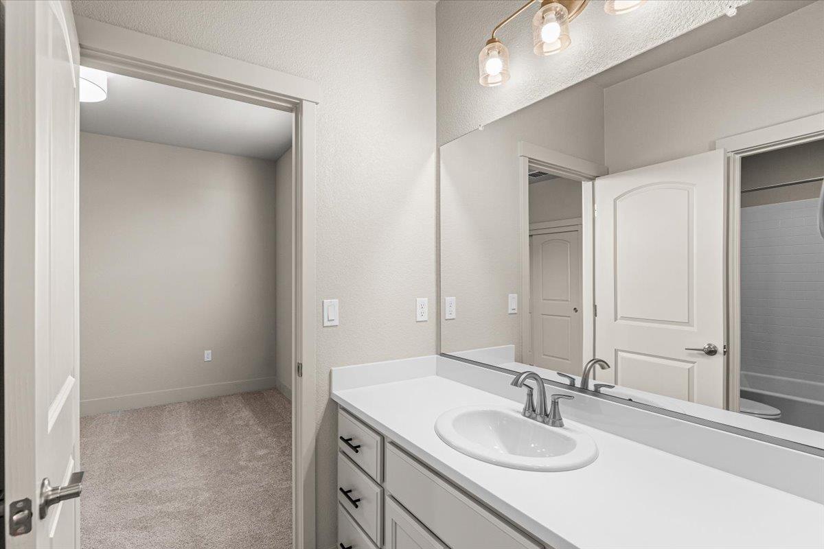 2970 East Tuolumne Road Turlock, CA 95382 - Photo 44 of 68 a bathroom with a sink and a mirror