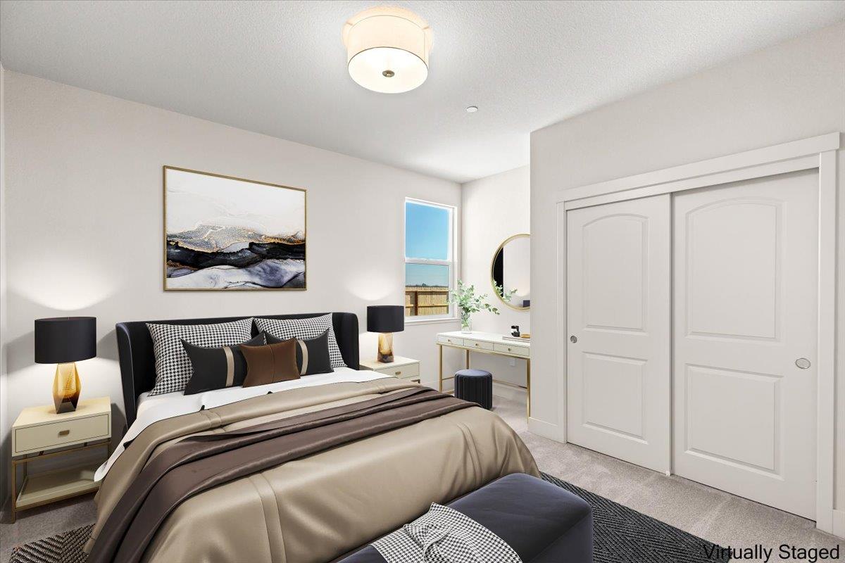 2970 East Tuolumne Road Turlock, CA 95382 - Photo 50 of 68 a bedroom with a bed and a painting on the wall