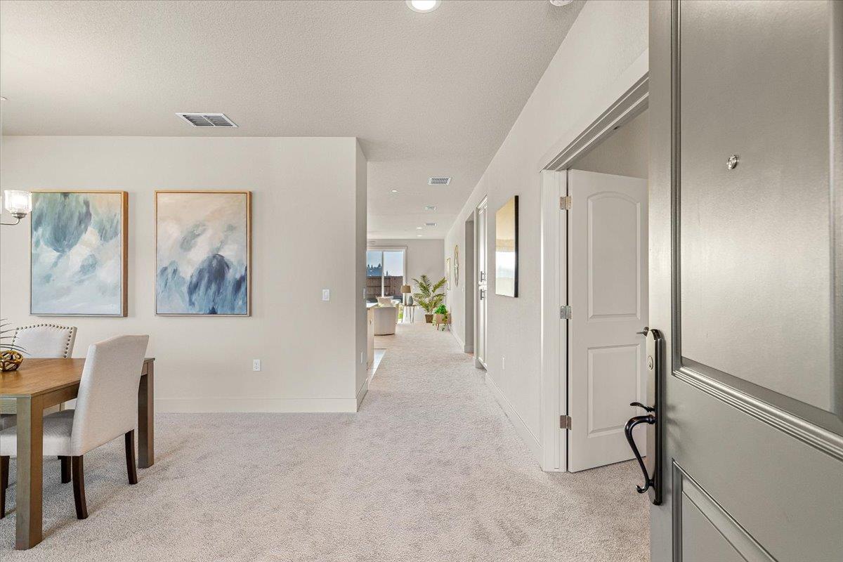 2970 East Tuolumne Road Turlock, CA 95382 - Photo 6 of 68 a view of a hallway with workspace and a window