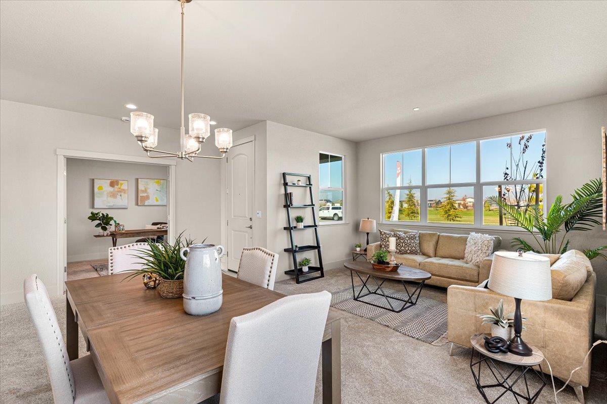 2970 East Tuolumne Road Turlock, CA 95382 - Photo 10 of 68 a living room with furniture potted plant and kitchen view
