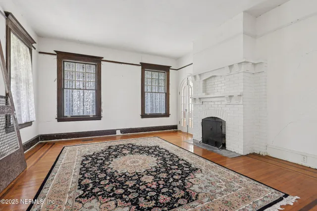 a kitchen with granite countertop a refrigerator and a sink