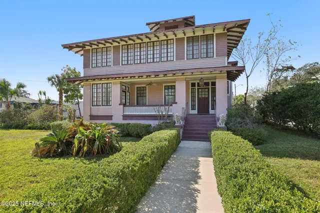 a view of a house with fountain and garden