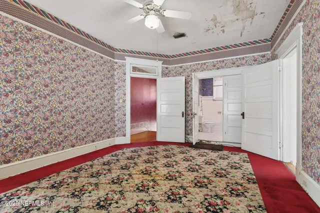 a view of an empty room with a window