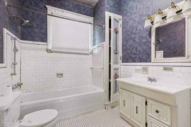 a big house with palm trees in front of it