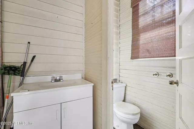 a view of a chairs and fire pit in the patio