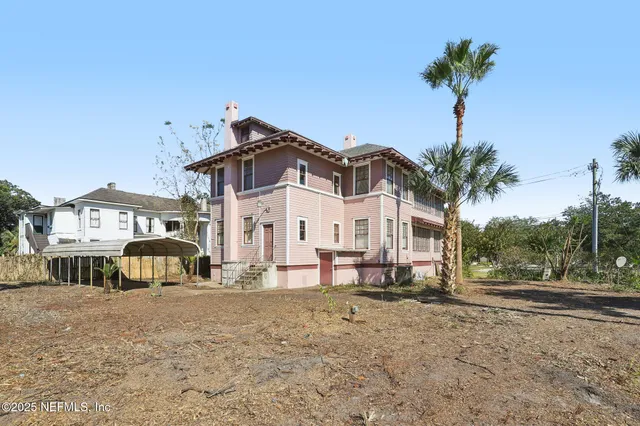 a front view of a building with parking space