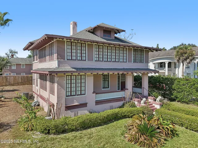 a view of a street with cars