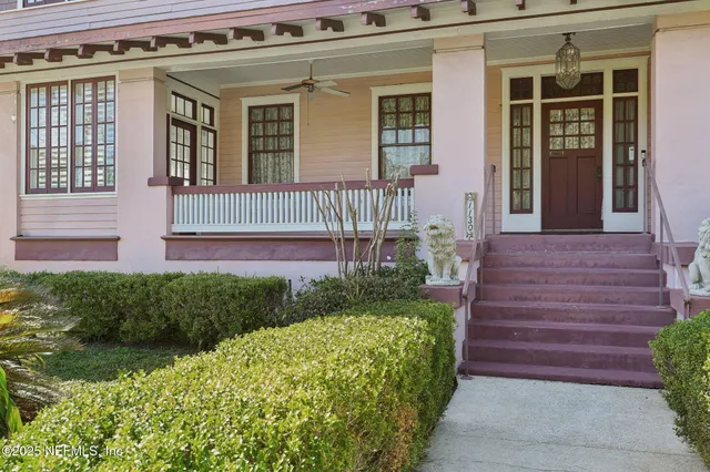 a view of a porch with chairs and backyard