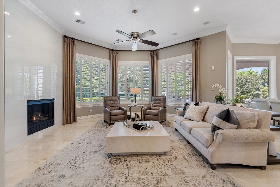 82 Manor Lake Estates Circle Spring, TX 77379 - Photo 13 of 50 a living room with furniture fireplace and large windows