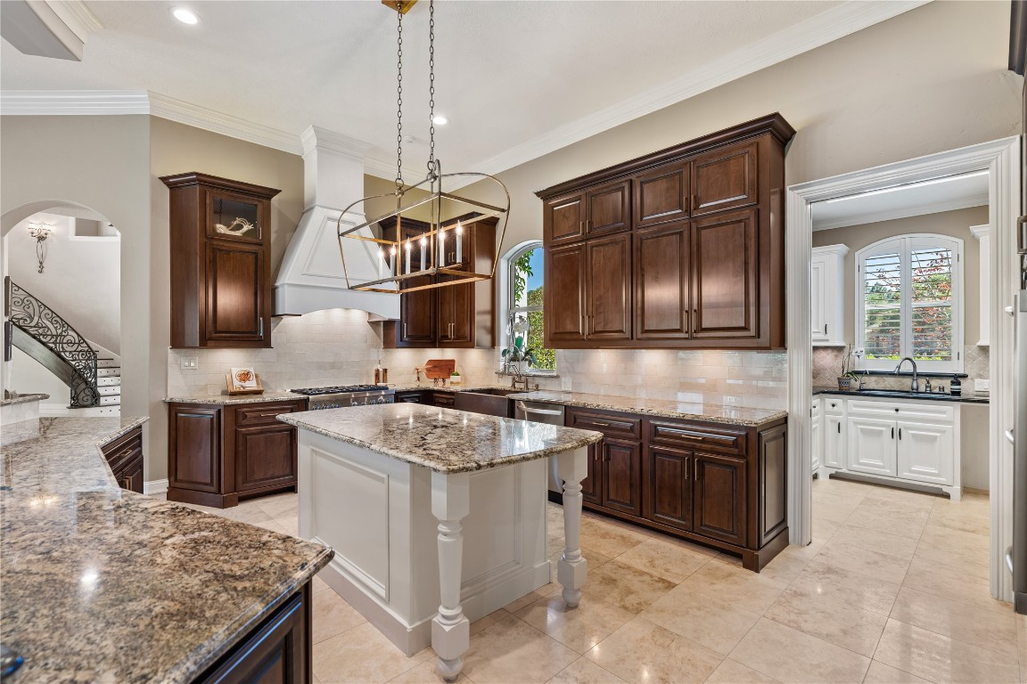 82 Manor Lake Estates Circle Spring, TX 77379 - Photo 15 of 50 a kitchen with stainless steel appliances granite countertop a stove a sink and a refrigerator