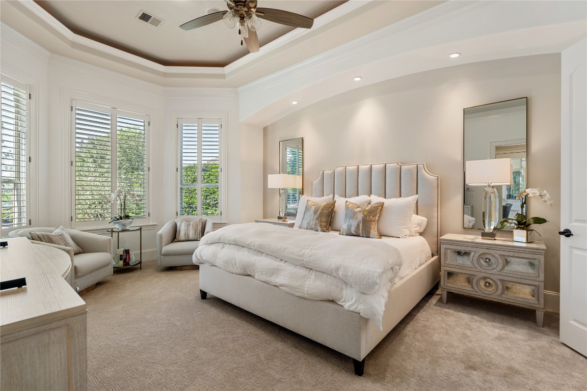 82 Manor Lake Estates Circle Spring, TX 77379 - Photo 25 of 50 a spacious bedroom with a bed and a couch