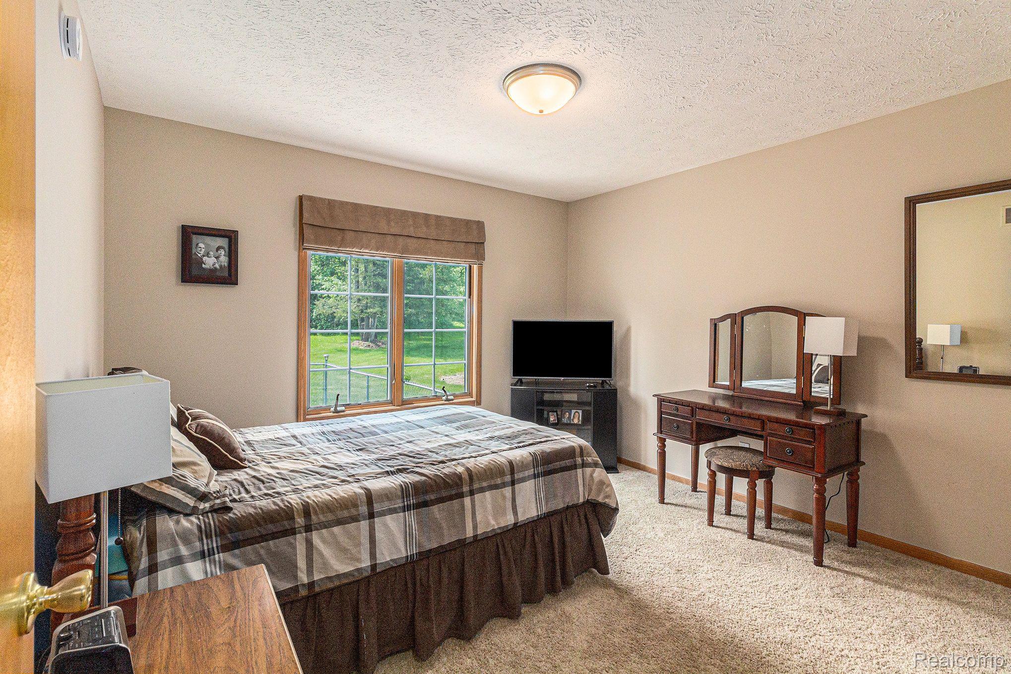 7611 East Highland Road Howell, MI 48855 - Photo 14 of 33 Front Bedroom