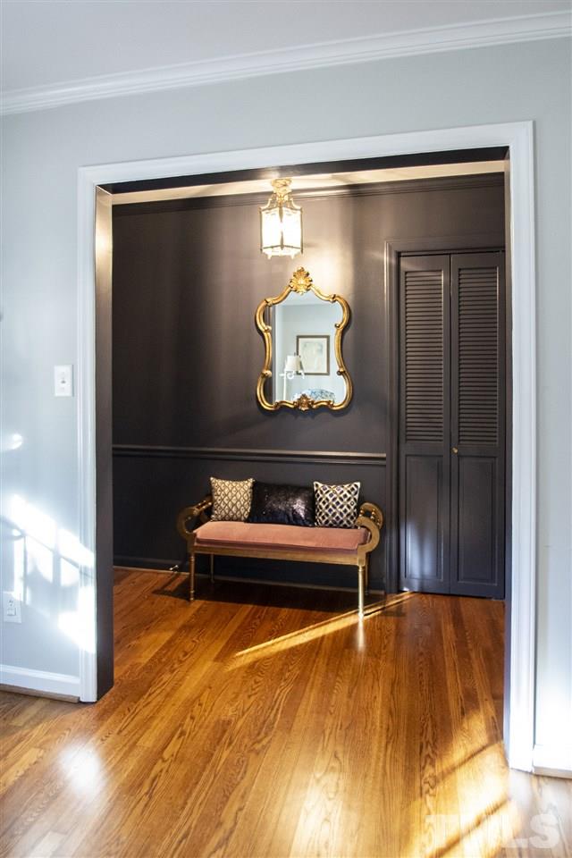 2324 Ridge Road Raleigh, NC 27612 - Photo 2 of 25 a wooden bench sitting in a room