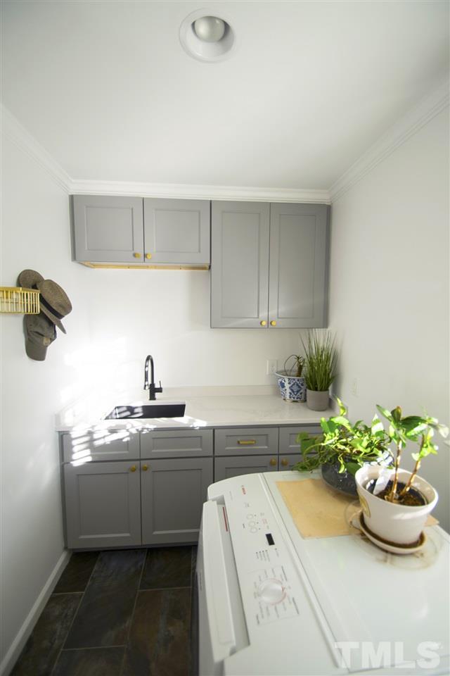 2324 Ridge Road Raleigh, NC 27612 - Photo 11 of 25 a kitchen with a sink and cabinets
