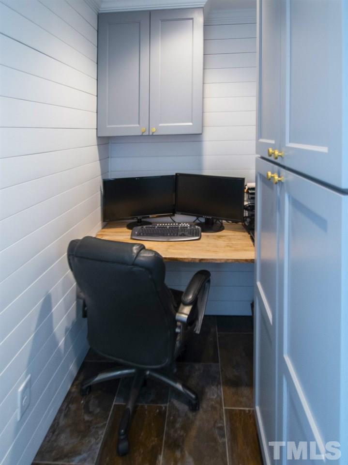 2324 Ridge Road Raleigh, NC 27612 - Photo 13 of 25 a room with a table and chairs